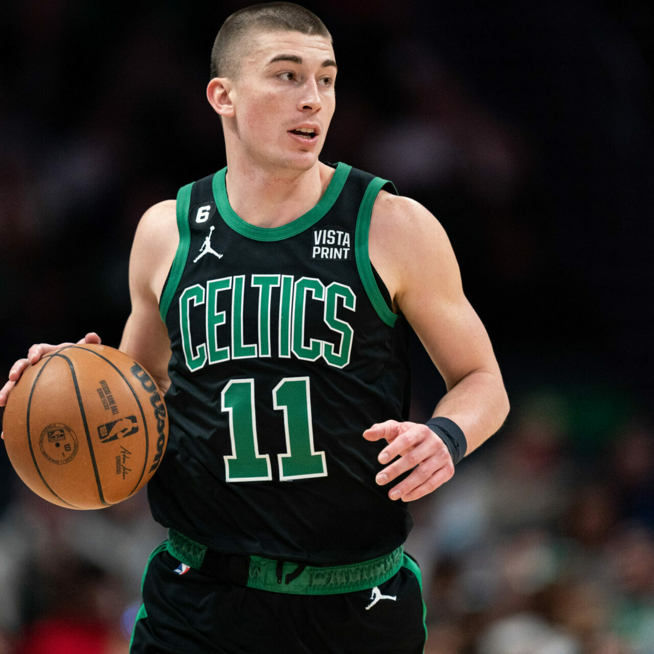 CHARLOTTE, NORTH CAROLINA - JANUARY 16: Payton Pritchard #11 of the Boston Celtics brings the ball up court against the Charlotte Hornets during their game at Spectrum Center on January 16, 2023 in Charlotte, North Carolina. NOTE TO USER: User expressly acknowledges and agrees that, by downloading and or using this photograph, User is consenting to the terms and conditions of the Getty Images License Agreement. (Photo by Jacob Kupferman/Getty Images)